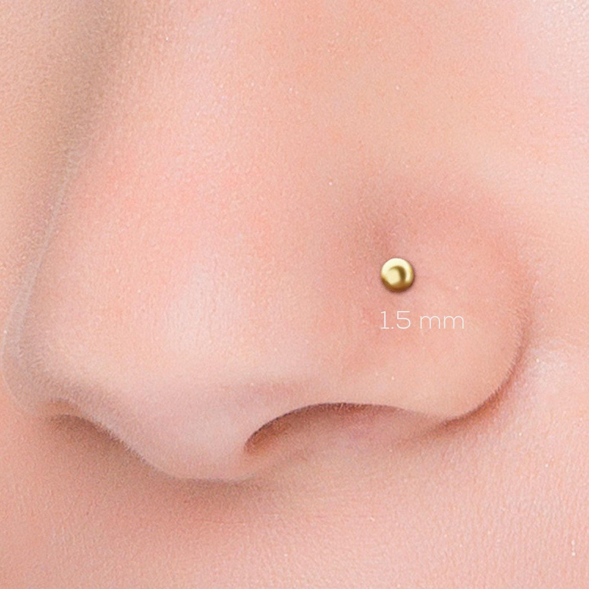 A close-up image of a person's nose with a gold-colored stud inserted, and the size of the stud is indicated as 15 millimeters.