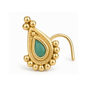 A gold nose pin with a green gemstone in the center, surrounded by small golden balls.