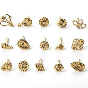 Solid 14k Gold Stud Earrings: a collection of 12 gold-colored earrings arranged in a grid pattern on a white background