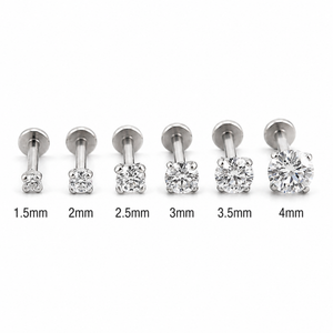 A collection of six different sizes of diamond-encrusted piercings, ranging from 1.5mm to 4mm in diameter.
