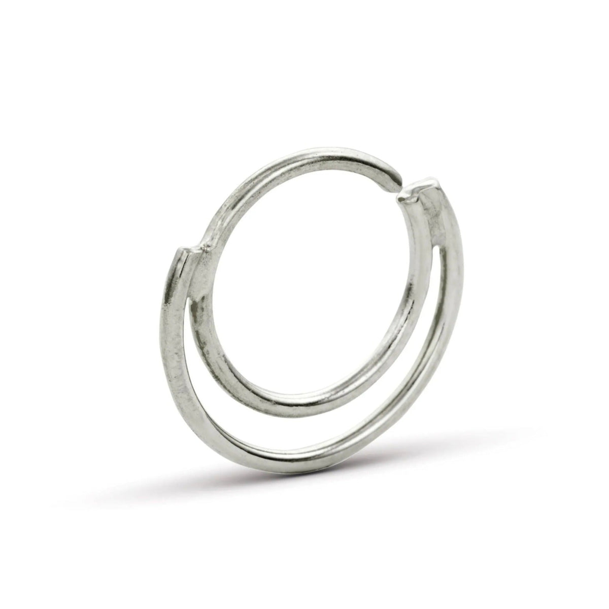A silver-colored ring with a unique, twisted design.