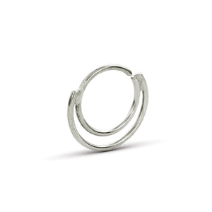A silver-colored ring with a unique, twisted design.