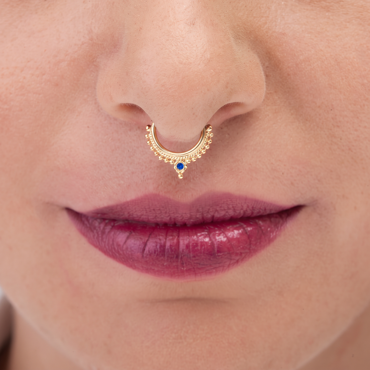 A close-up of a person's face, focusing on their nose and lips.