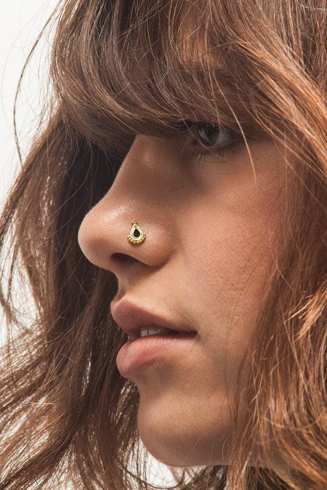 A close-up of a person's face, focusing on their nose and facial features.