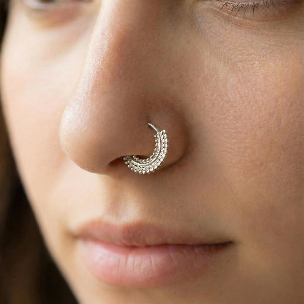 A close-up of a person's face, focusing on their nose and mouth area.