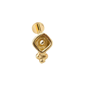 A gold-colored metal earring with a square-shaped hole in the center.