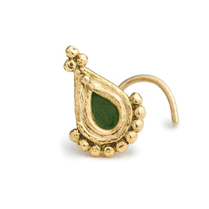 A gold-colored nose ring with a green gemstone in the center.