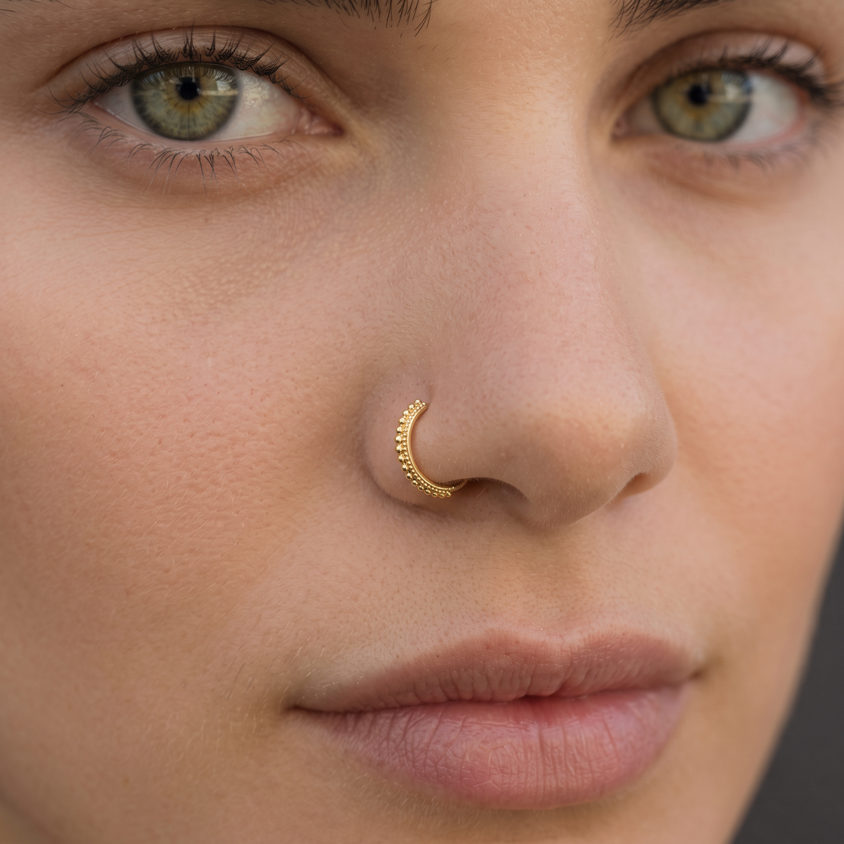 A close-up of a woman's face, focusing on her nose and lips.