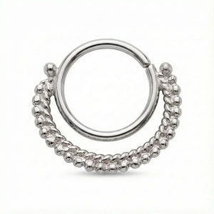 A silver-colored metal ring with a twisted, braided design.