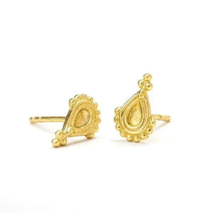 a pair of gold earrings with intricate designs, including a teardrop-shaped pendant and small round decorations.