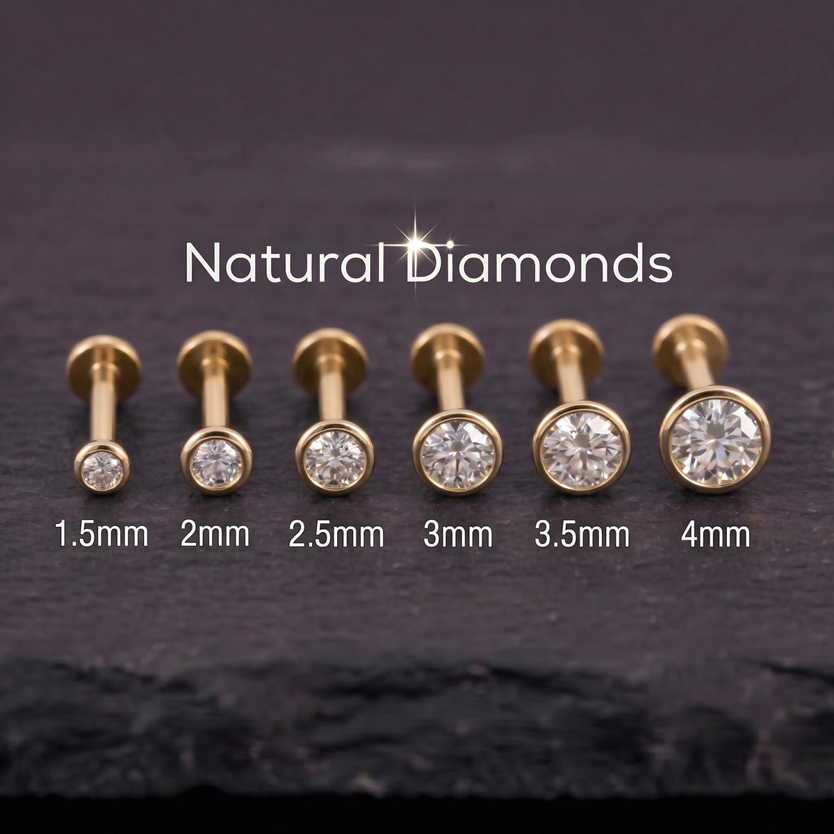 A collection of gold-colored diamond-encrusted piercings, ranging from 1.5mm to 4mm in size, arranged in a row on a dark surface.