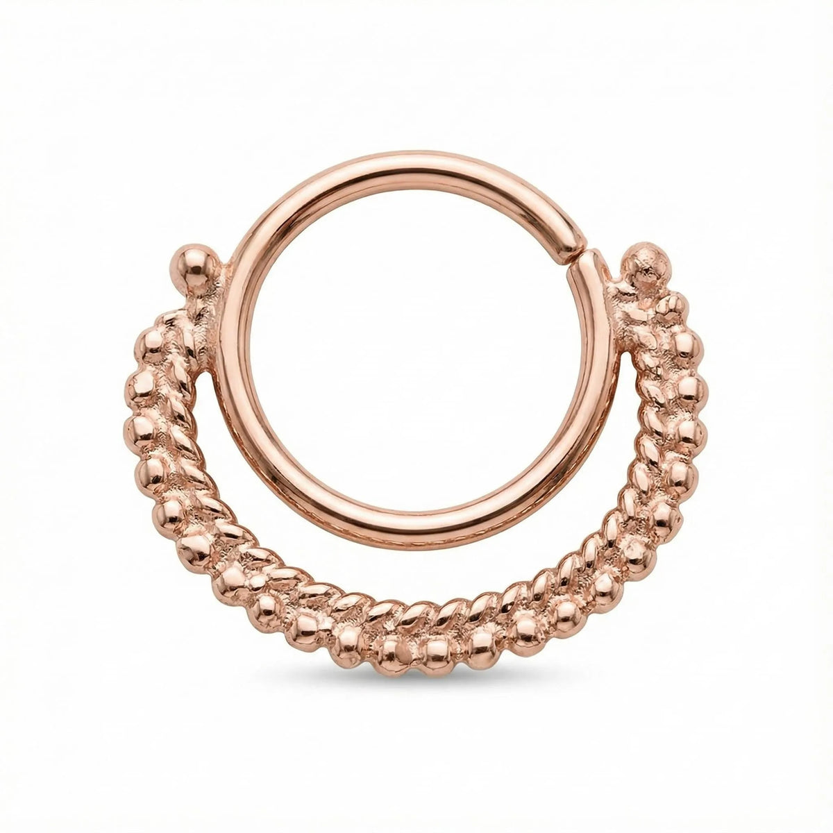 a piece of jewelry, specifically a ring, with a circular design and a decorative element around the edge.