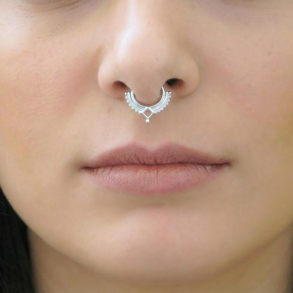 A close-up of a person's face, focusing on their nose and mouth area.